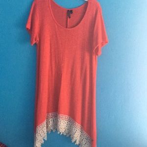 Coral color knit top.